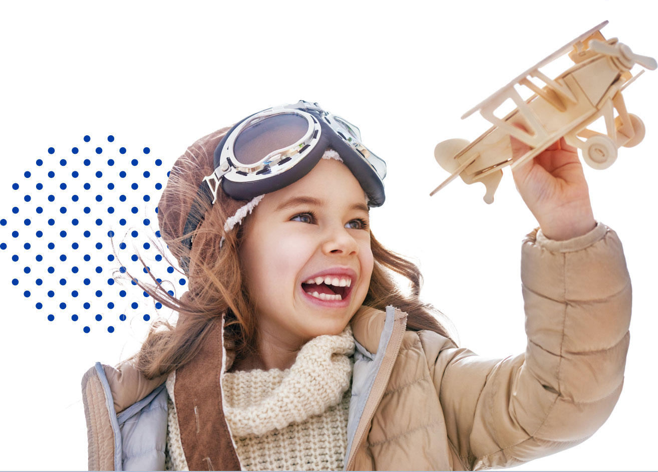 happy child holding an airplane in hand